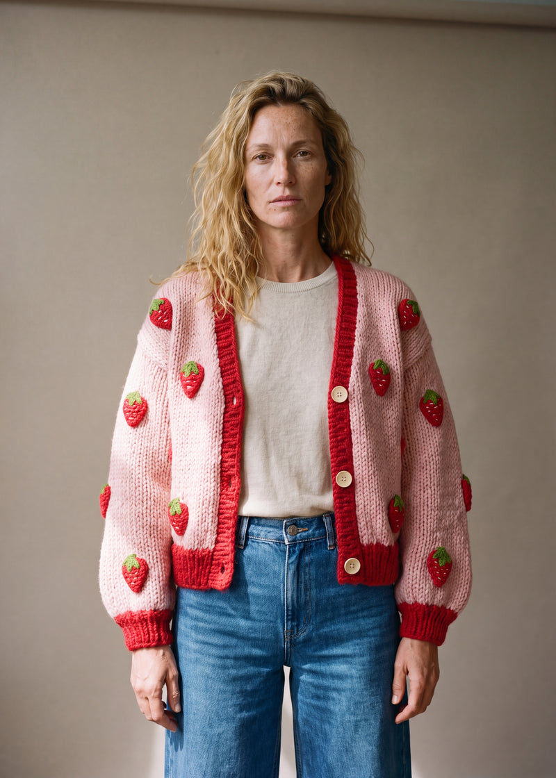 Strawberry  – Chunky Wool Hand-Knitted Cardigan - soft pink body chunky hand-knitted wool cardigan with crocheted motifs, worn open over a plain top by Ana Chic