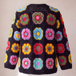 Black crochet cardigan with hexagonal African-flower blocks in pink, yellow, red and blue, back view with openwork mesh neck band - handmade by Ana Chic