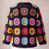 Black crochet cardigan with hexagonal African-flower blocks in pink, yellow, red and blue, back view with openwork mesh neck band - handmade by Ana Chic