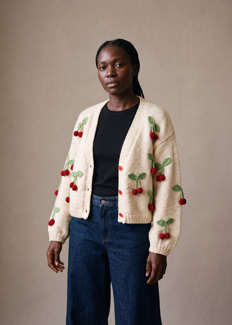 Cherry Knitted Cardigan - cream chunky hand-knitted wool cardigan with crocheted motifs, worn open over a plain top by Ana Chic