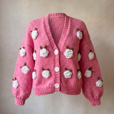 Rose Bubblegum cardigan front — bubblegum pink chunky hand-knitted wool cardigan with crocheted white roses and white buttons, handmade by Ana Chic