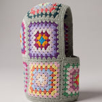 Sage multicolour granny square balaclava standing on its own, back view of the hood — handmade by Ana Chic