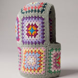 Sage multicolour granny square balaclava standing on its own, back view of the hood — handmade by Ana Chic