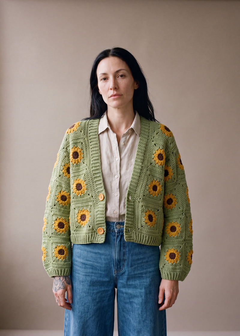 Daisy – Cotton Crochet Cardigan - Sage green crocheted granny square cardigan with raised crochet sunflowers, worn by Ana Chic