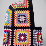 Black pastel granny square balaclava laid flat, side view of the hood — handmade by Ana Chic