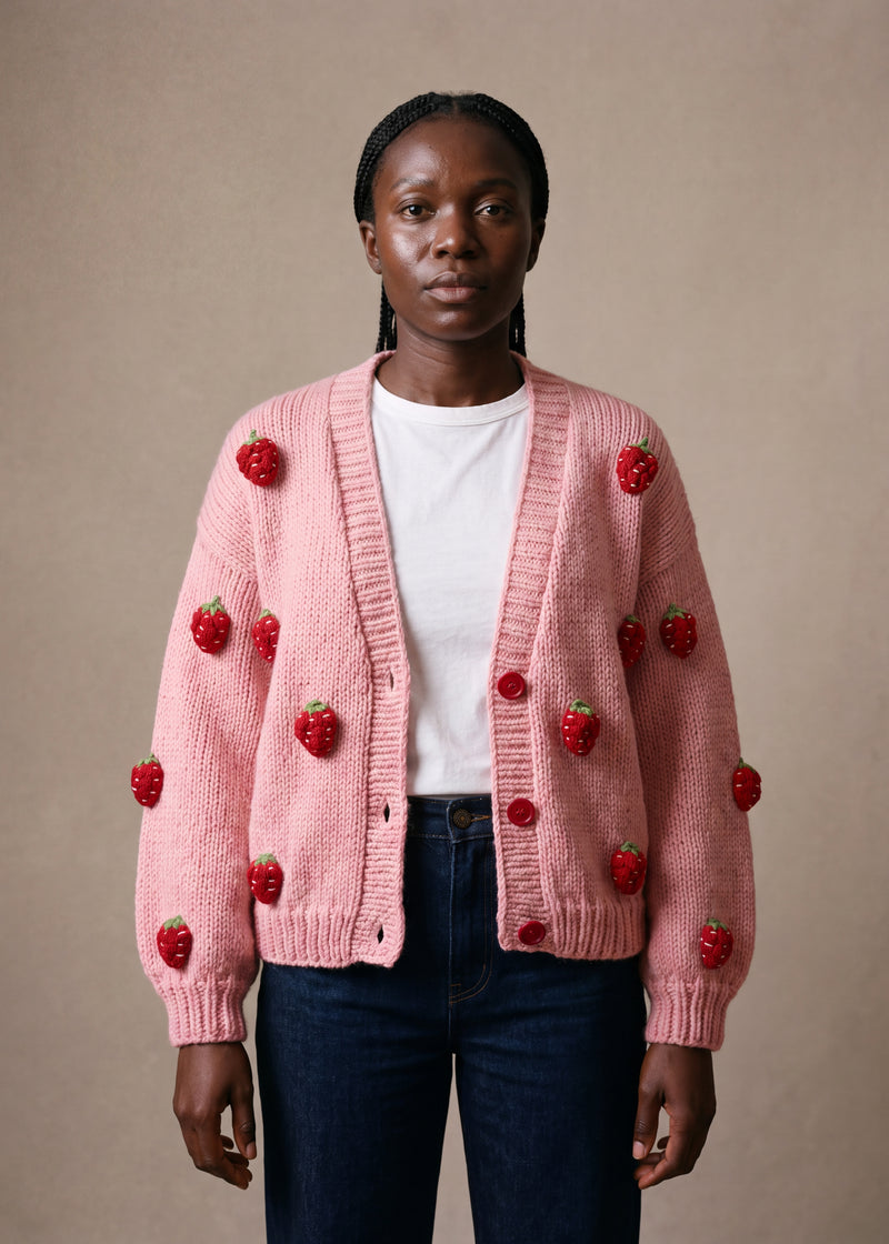 Strawberry cardigan - soft rose pink chunky hand-knitted wool cardigan with crocheted motifs, worn open over a plain top by Ana Chic