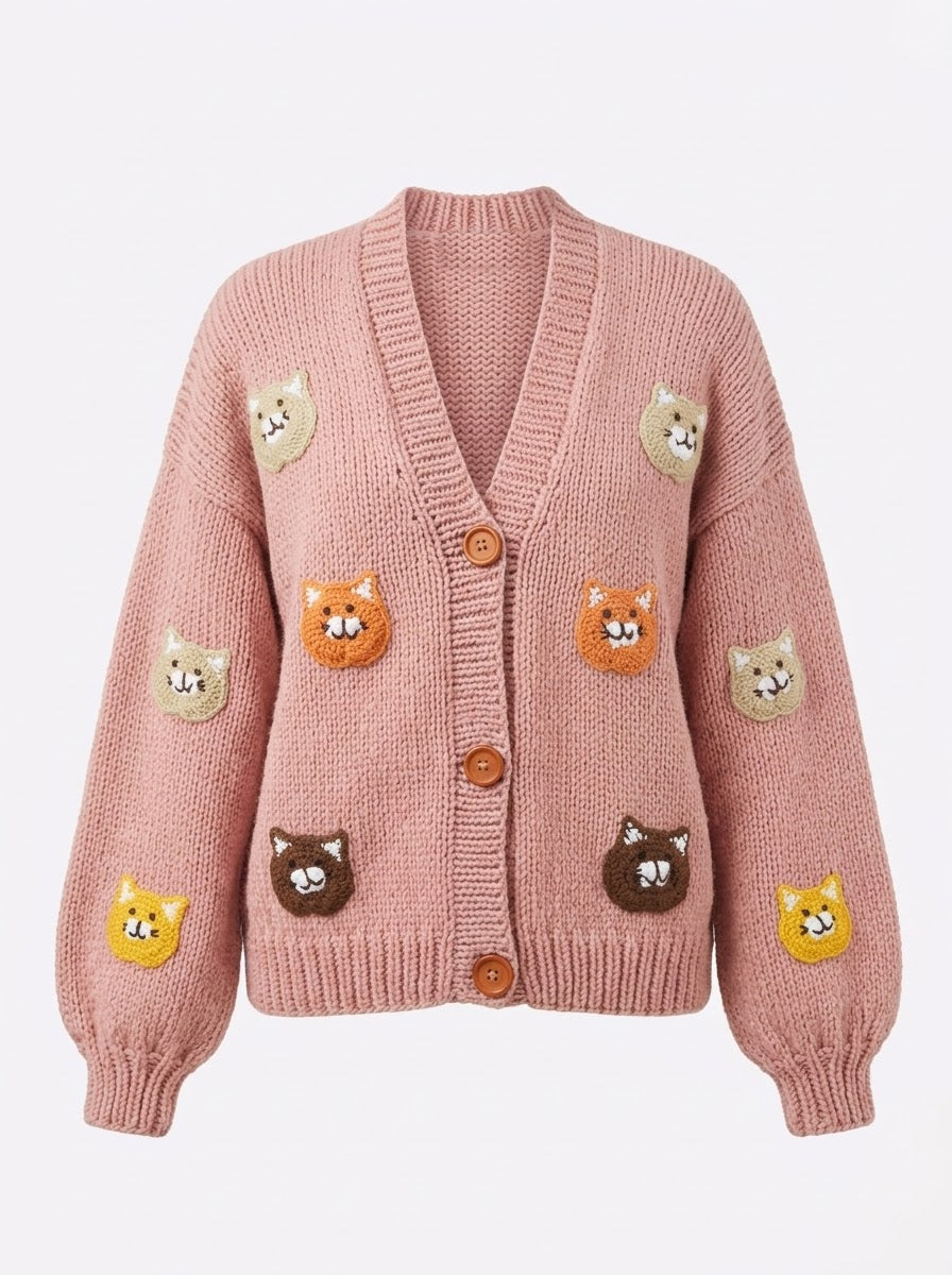 Pink cat motif handmade knitted cardigan, flat lay front view