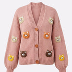 Pink cat motif handmade knitted cardigan, flat lay front view