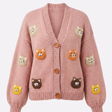 Pink cat motif handmade knitted cardigan, flat lay front view