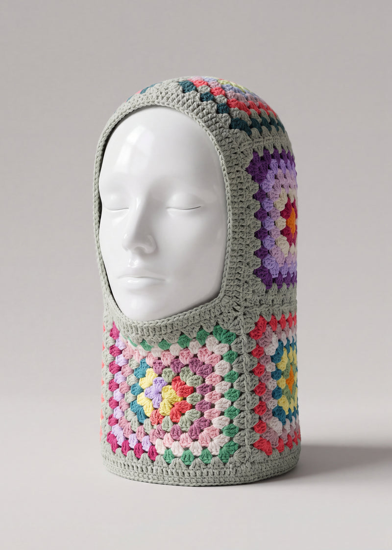 Sage multicolour granny square balaclava on a display head, open face and deep neck section — handmade by Ana Chic