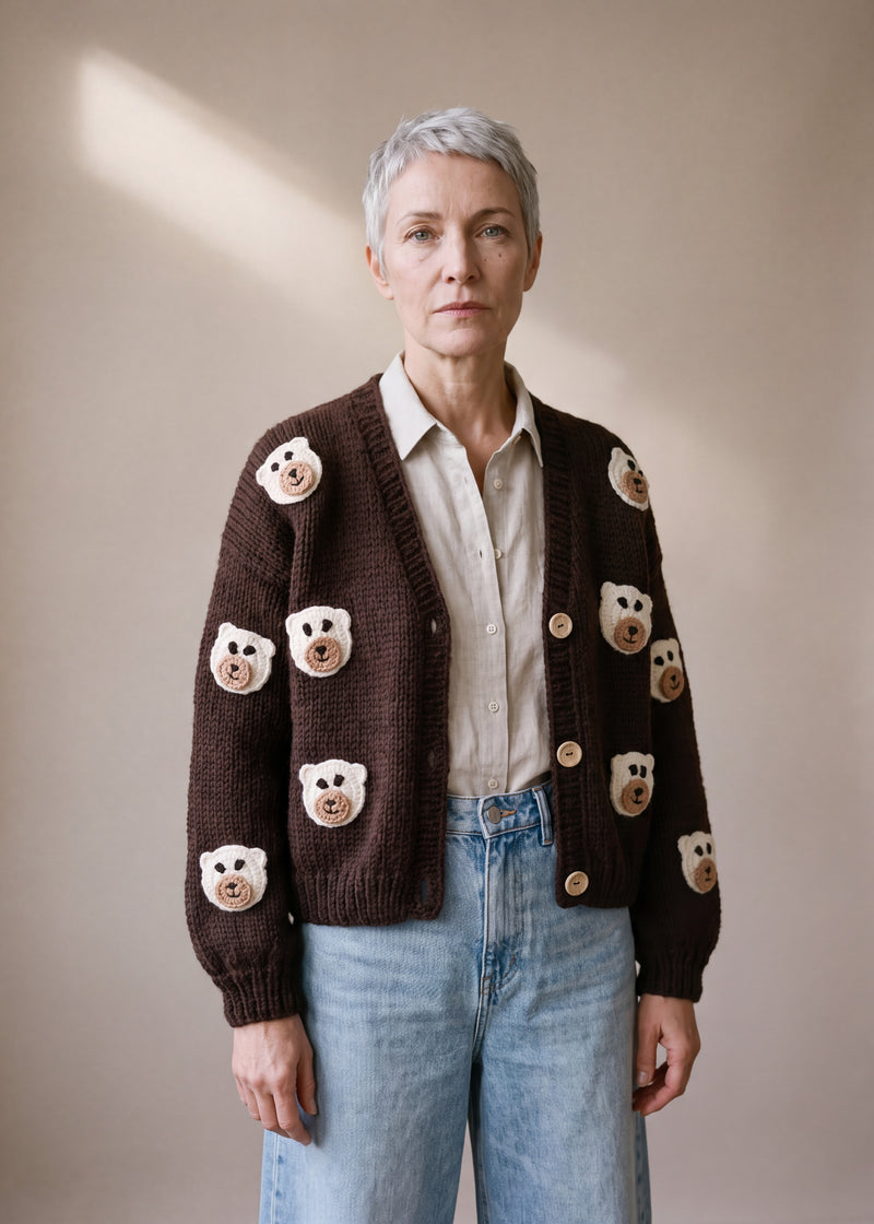 Teddy - dark chocolate brown chunky hand-knitted wool cardigan with crocheted motifs, worn open over a plain top by Ana Chic
