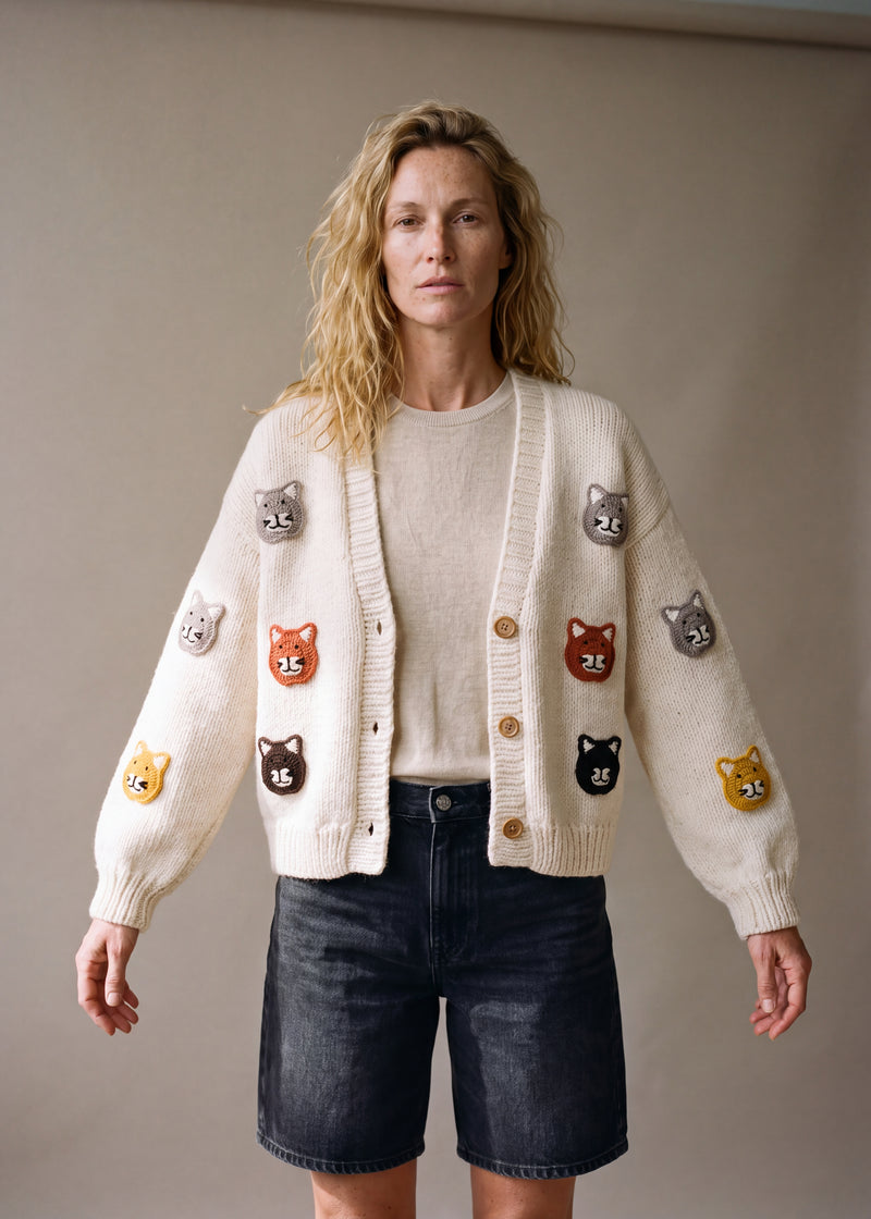 Cat cardi - cream chunky hand-knitted wool cardigan with crocheted motifs, worn open over a plain top by Ana Chic