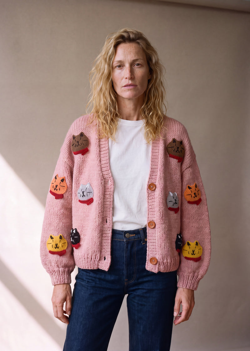 Cat Cardi - soft pink chunky hand-knitted wool cardigan with crocheted cat motifs, worn open over a plain top by Ana Chic