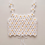 Back of the Daisy crochet crop top, laced with a crocheted cord and tied in a bow