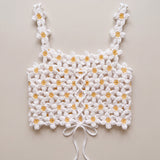 Back of the Daisy crochet crop top, laced with a crocheted cord and tied in a bow