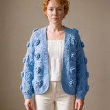 Cornflower blue rose crochet cardigan worn open over a white top and ecru jeans — handmade by Ana Chic