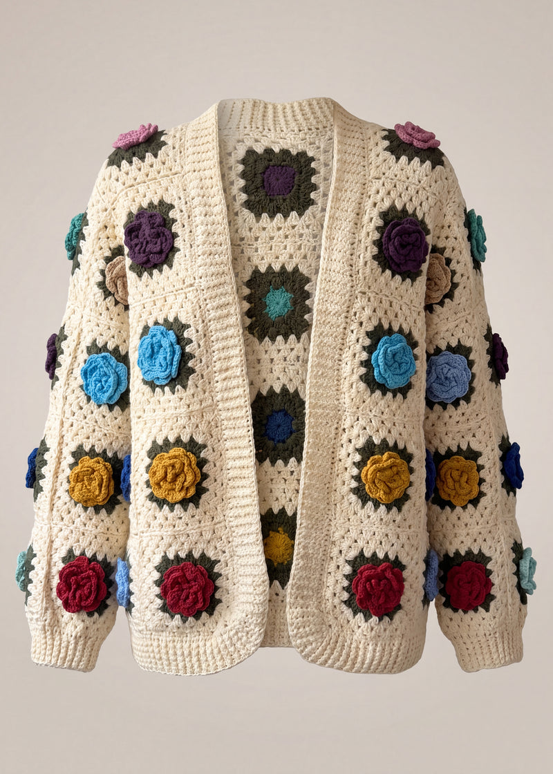 Cream granny-square cardigan with raised multicolour crochet roses, open front and softly full sleeves gathered into ribbed cuffs — handmade by Ana Chic