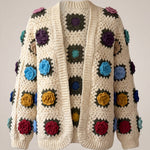 Cream granny-square cardigan with raised multicolour crochet roses, open front and softly full sleeves gathered into ribbed cuffs — handmade by Ana Chic