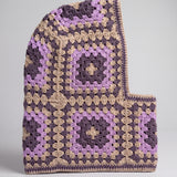 Sand and plum granny square balaclava laid flat, side view of the hood — handmade by Ana Chic