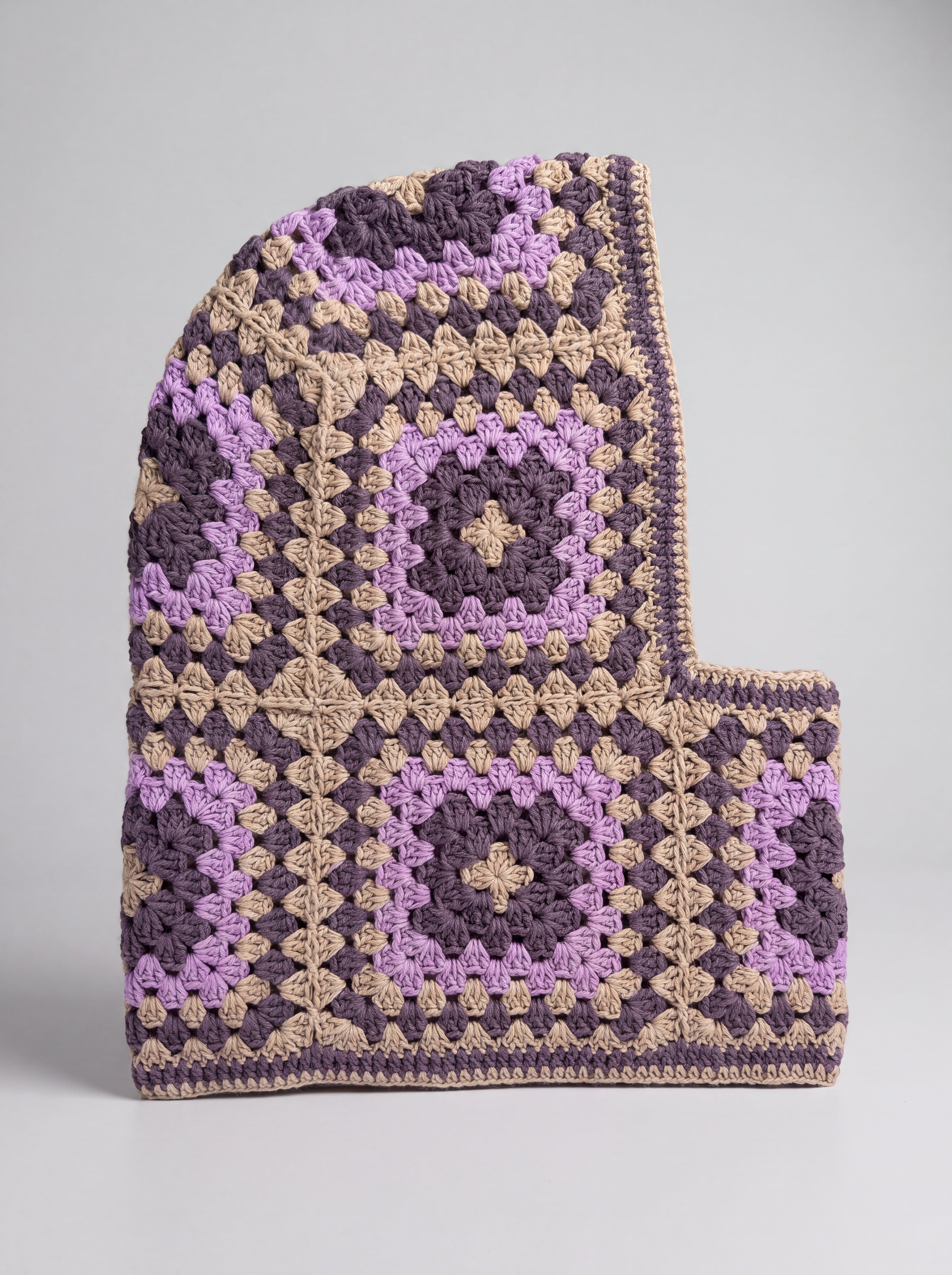 Sand and plum granny square balaclava laid flat, side view of the hood — handmade by Ana Chic