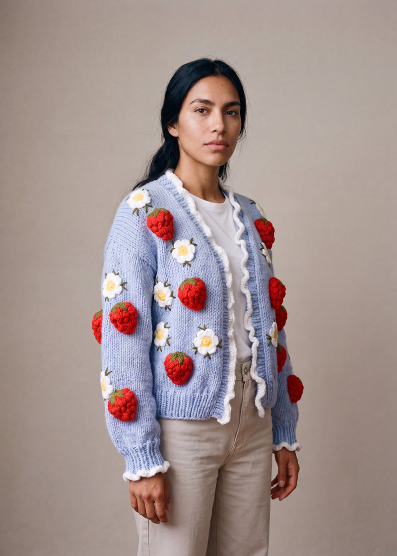 Strawberry&Daisy Hand Knitted Cardigan - powder blue chunky hand-knitted wool cardigan with crocheted motifs, worn open over a plain top by Ana Chic