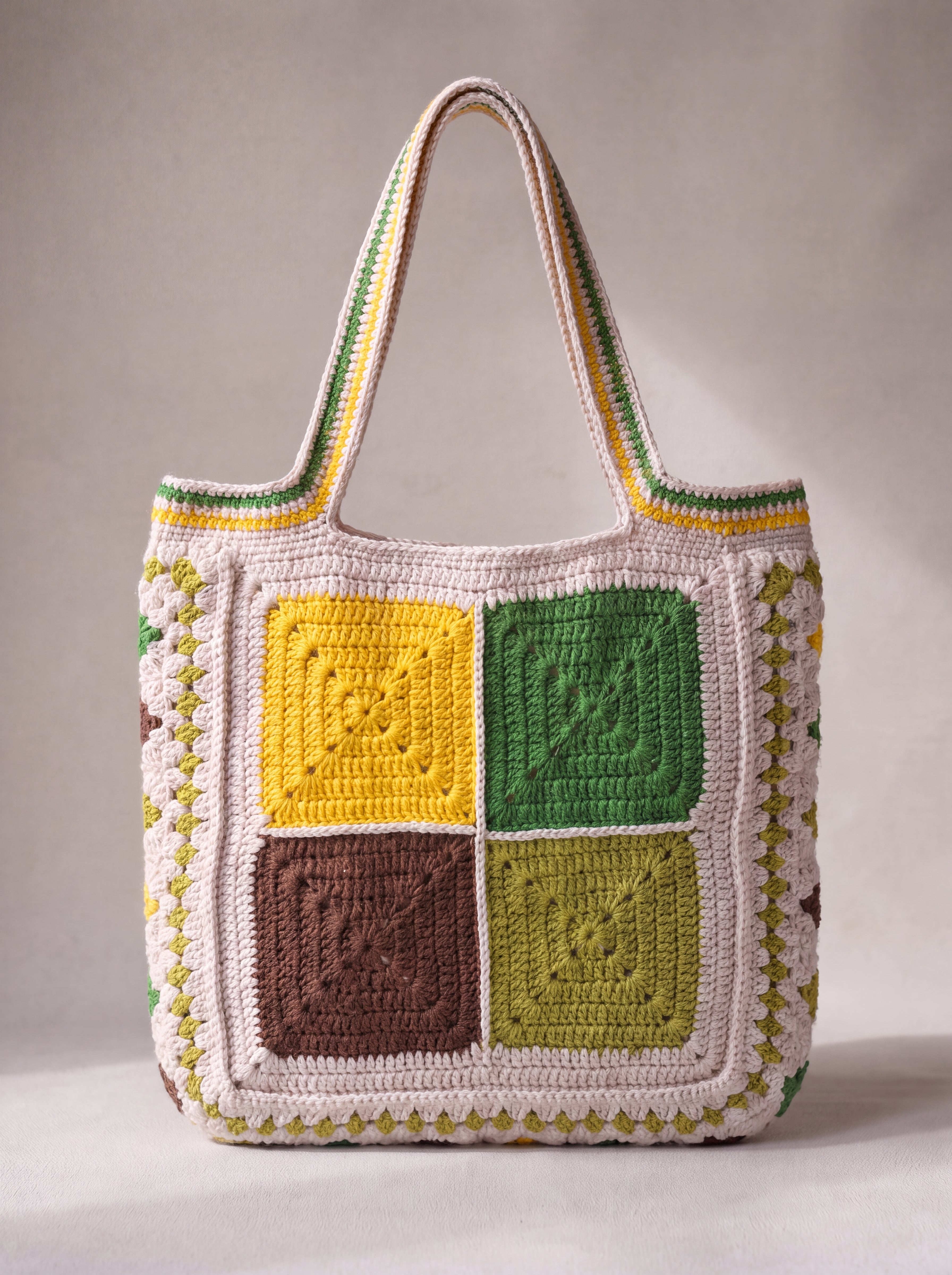 Back of the green crochet tote bag with four plain granny squares — handmade by Ana Chic