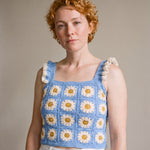 Blue Daisy Crochet Top worn with a white denim skirt, cream daisy granny squares and ruffle straps — handmade by Ana Chic