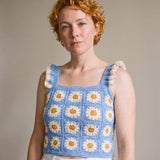 Blue Daisy Crochet Top worn with a white denim skirt, cream daisy granny squares and ruffle straps — handmade by Ana Chic