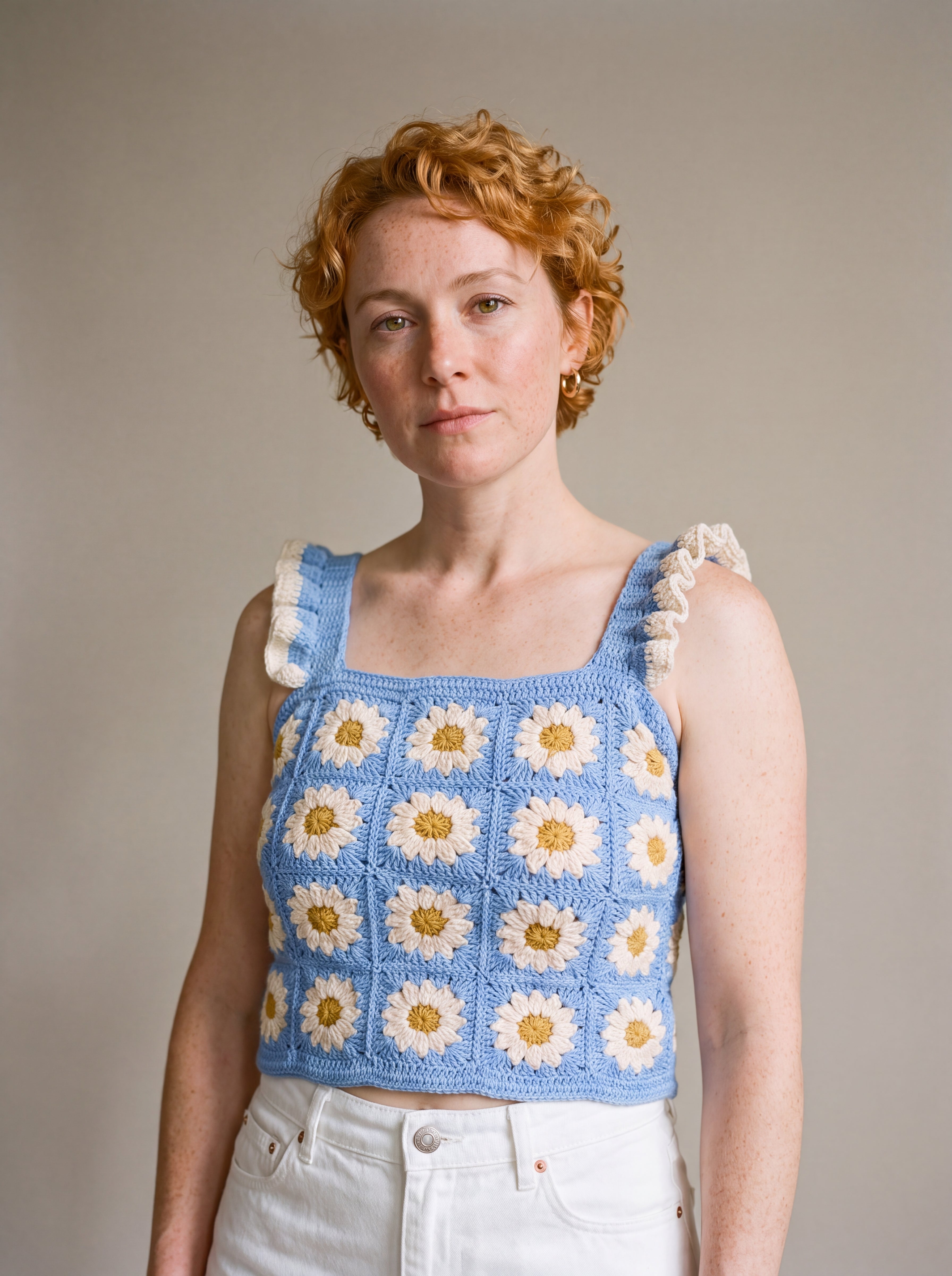 Blue Daisy Crochet Top worn with a white denim skirt, cream daisy granny squares and ruffle straps — handmade by Ana Chic