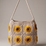 Front of the beige crochet crossbody bag with four sunflower squares and a long braided strap — handmade by Ana Chic
