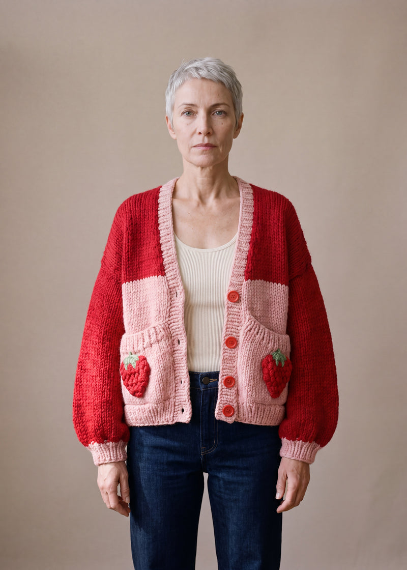 Strawberry Pocket – Chunky Wool Hand-Knitted Cardigan - bright red body chunky hand-knitted wool cardigan with crocheted motifs, worn open over a plain top by Ana Chic