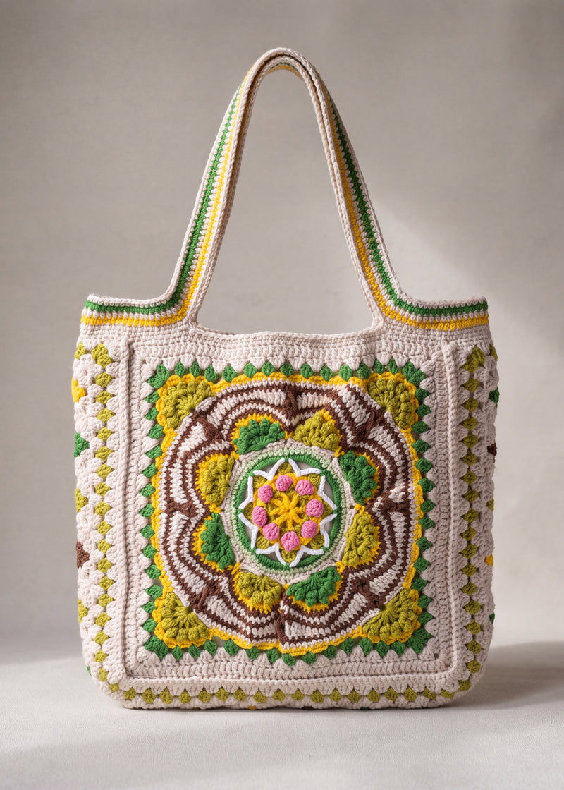 Front of the green crochet tote bag with its raised crocheted medallion — handmade by Ana Chic