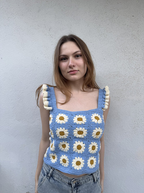 Customer wearing a blue daisy crochet top