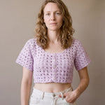 Ivory hand-crocheted organic cotton cropped top in lilac, worn buttoned with five pearl buttons - Ana Chic