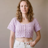 Ivory hand-crocheted organic cotton cropped top in lilac, worn buttoned with five pearl buttons - Ana Chic