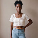 Ivory hand-crocheted organic cotton cropped top in white, worn buttoned with five pearl buttons - Ana Chic