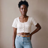 Ivory hand-crocheted organic cotton cropped top in white, worn buttoned with five pearl buttons - Ana Chic