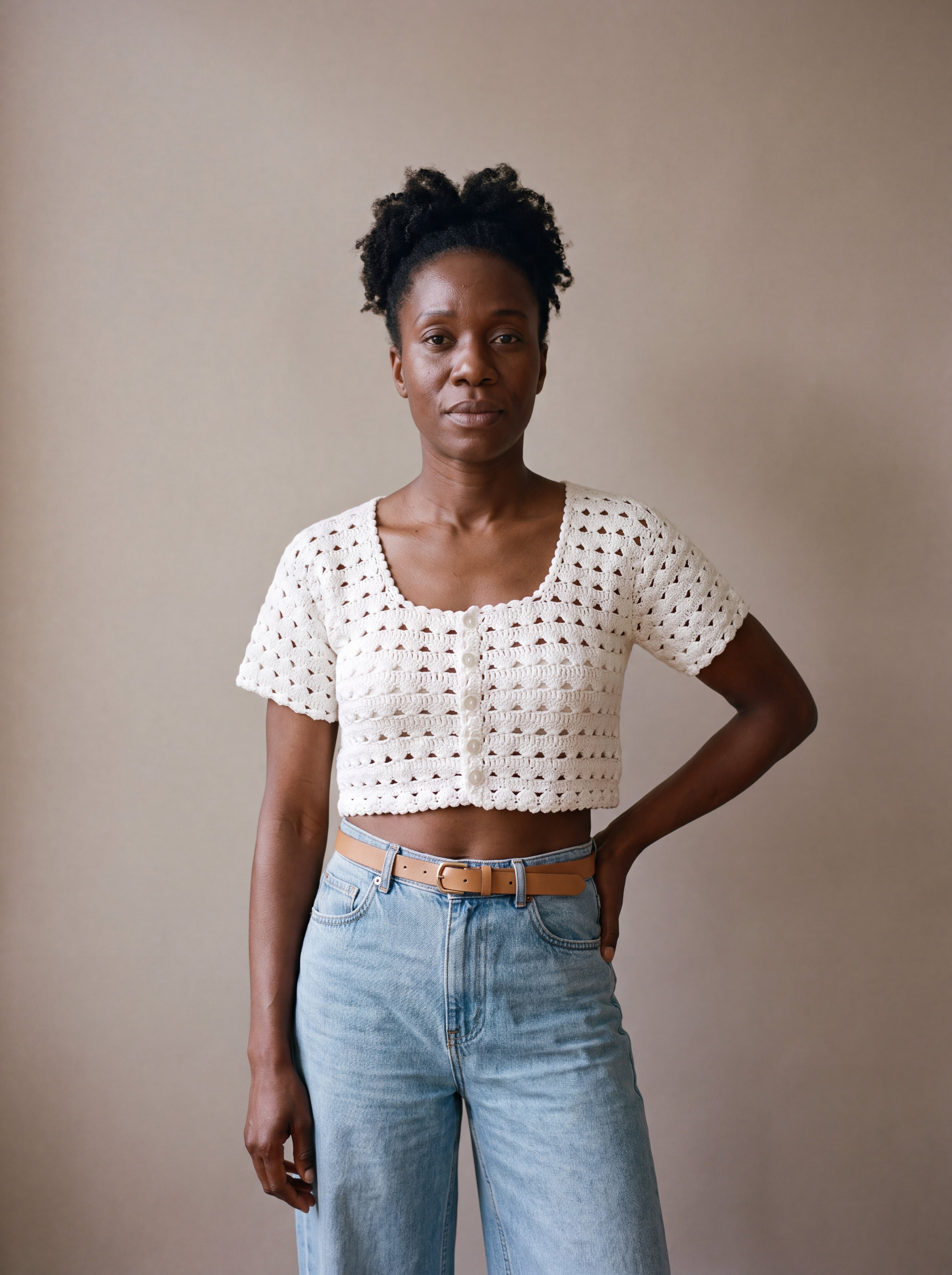 Ivory hand-crocheted organic cotton cropped top in white, worn buttoned with five pearl buttons - Ana Chic