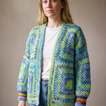 Lime, aqua and denim-blue granny square cardigan worn open over a white tee — handmade by Ana Chic