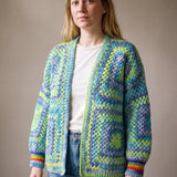 Lime, aqua and denim-blue granny square cardigan worn open over a white tee — handmade by Ana Chic