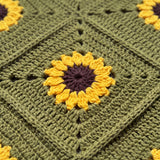 Close-up of the sunflower motif on khaki green crochet - handmade by Ana Chic