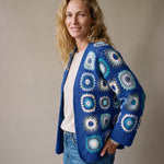 Mosaic Cardigan in cobalt and aqua worn open over an oatmeal fine-knit jumper with jeans - handmade by Ana Chic