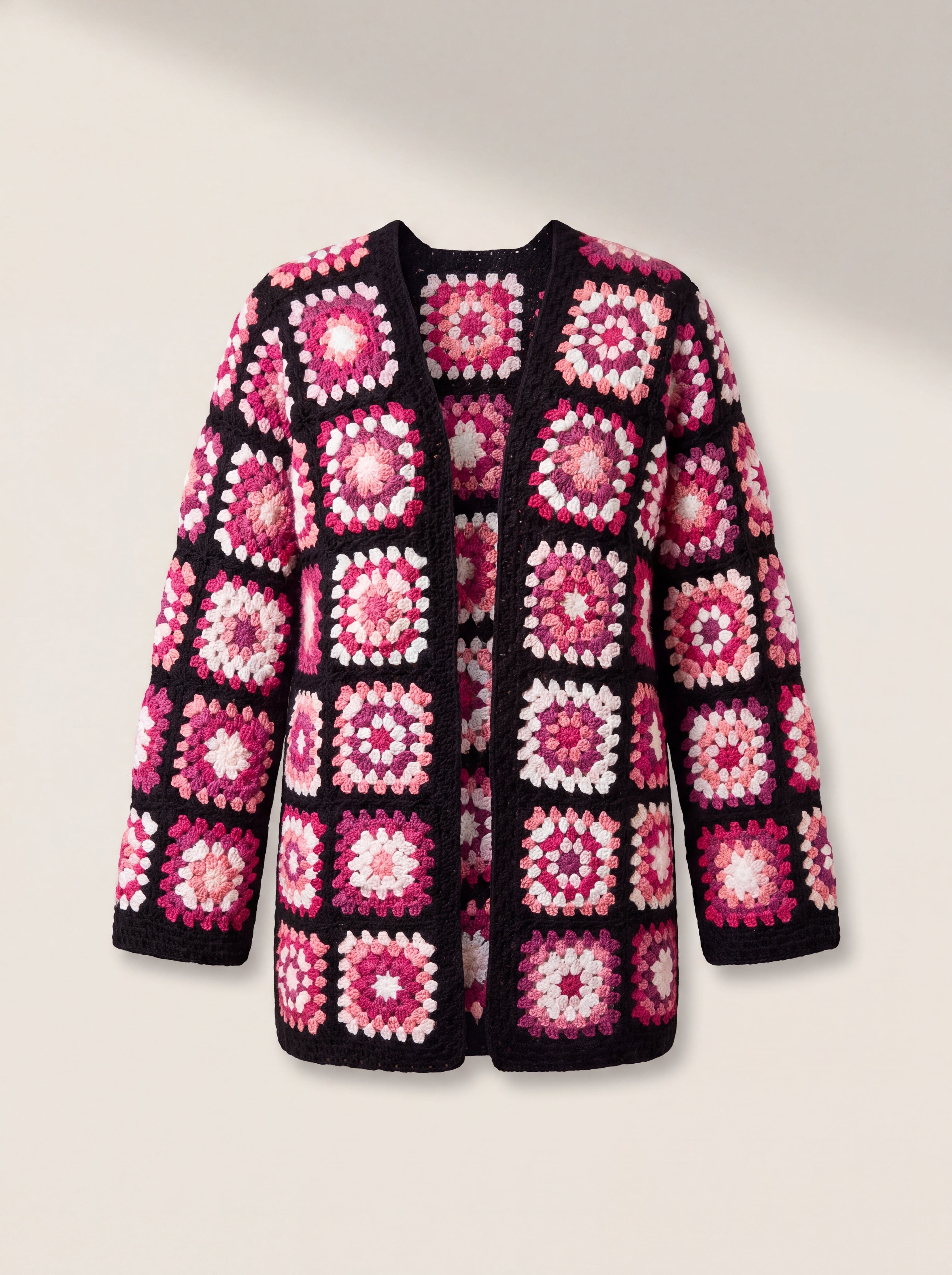 Front of the Long Cardigan in black and pink, crocheted squares in fuchsia, blush, plum and white on black - handmade by Ana Chic