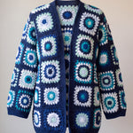 Front of the Long Cardigan in navy and turquoise, ringed crocheted squares in turquoise, mint, ice blue and white on navy - handmade by Ana Chic