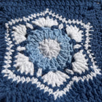 Macro of a hand-crocheted square with six white shell fans inside a hexagon on navy, Sampler Long Cardigan