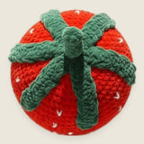 Velvet Strawberry Pillow — handmade velvet crochet amigurumi by Ana Chic, styled view