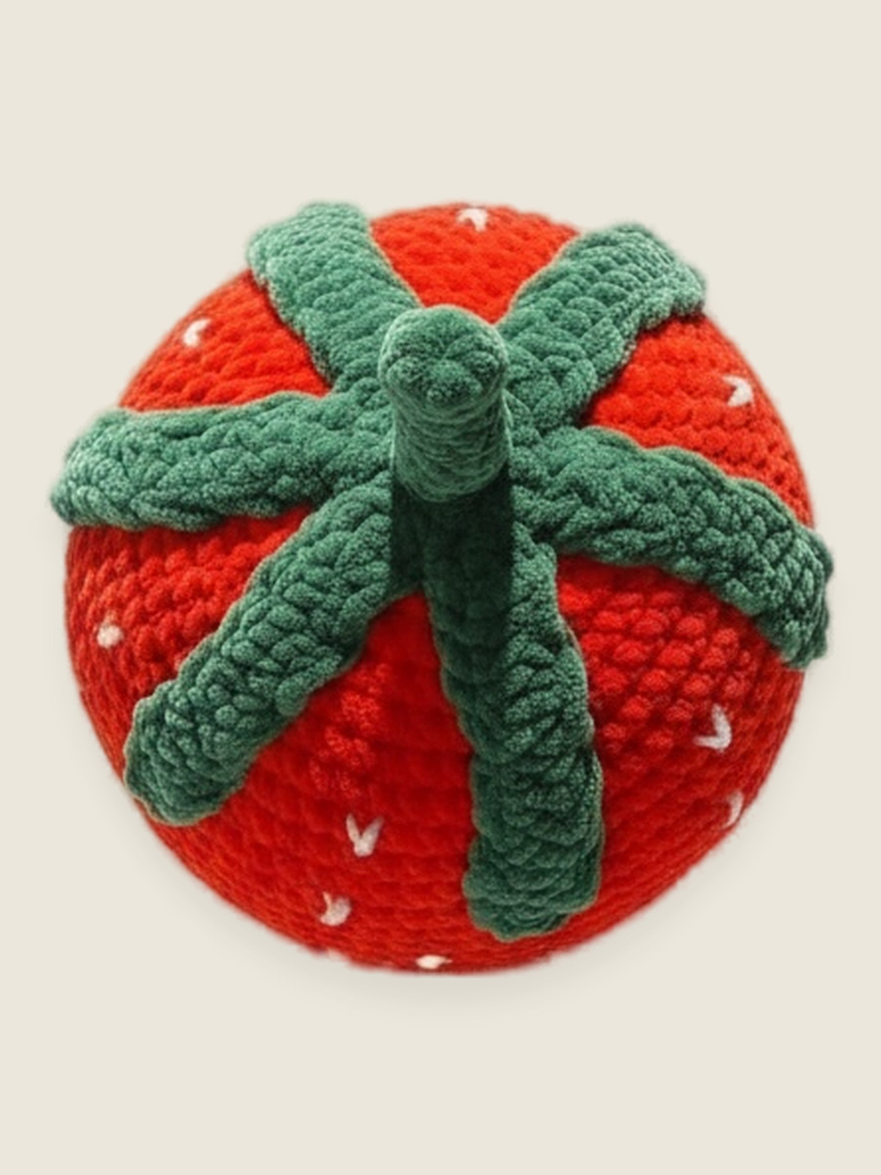 Velvet Strawberry Pillow — handmade velvet crochet amigurumi by Ana Chic, styled view